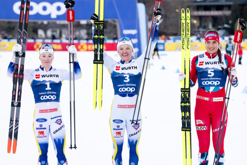 onna Sundling of Sweden, Linn Svahn of Sweden and Kristine Stavås Skistad of Norway celebrate after the women's cross-country skiing sprint final during Tour de Ski on December 30, 2023 in Toblach.