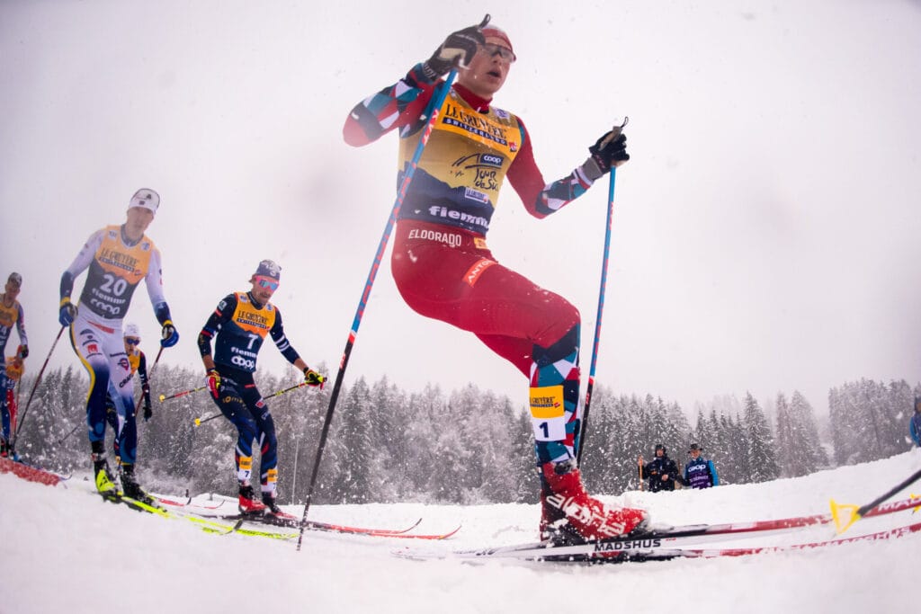 William Poromaa of Sweden, Hugo Lapalus of France and Harald Østberg Amundsen of Norway compete in men's 15 km classic technique mass start during Tour de Ski on January 6, 2024 in Val di Fiemme.