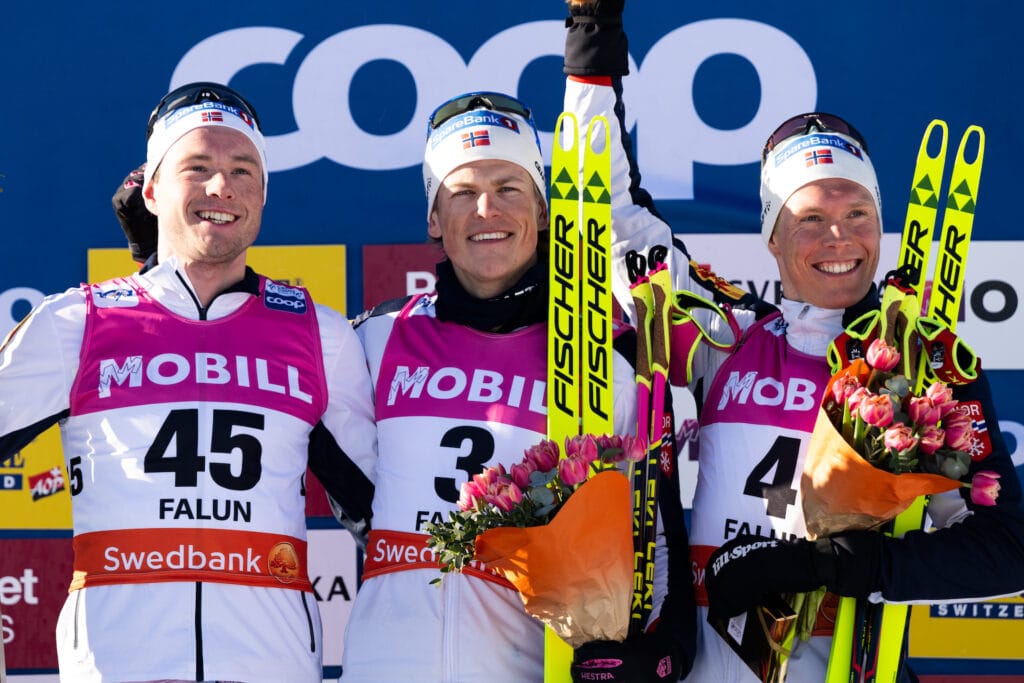 Gjøran Tefre, Johannes Høsflot Klæbo and Martin Løwstrøm Nyenget of Norway celebrate after the men's 20km mass start during the FIS Cross-Country World Cup on March 17, 2024 in Falun