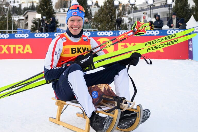 241215 Martin Løwstrøm Nyenget of Norway celebrates on the podium after the men's cross-country skiing 20 km classic technique interval start during the FIS Cross-Country World Cup on December 15, 2024 in Davos.
