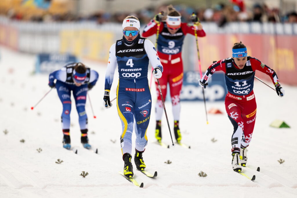 Linn Svahn of Sweden and Heidi Weng of Norway compete in the Women's Sprint semi final during day seven of Tour de Ski on January 3, 2025 in Tesero.
