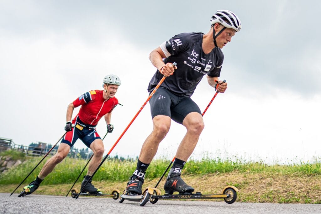 Sturla Holm Laegreid (NOR), Endre Stroemsheim (NOR), (l-r) - Biathlon summer training, Lavaze (ITA).