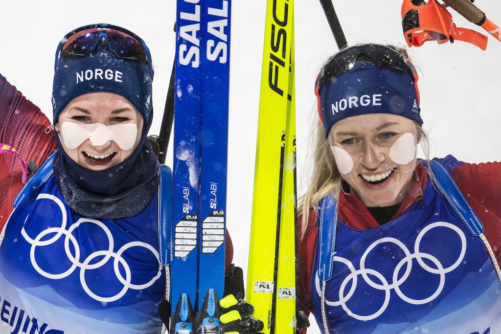 Marte Olsbu Røiseland of Norway and Tiril Eckhoff of Norway celebrate after competing in women's biathlon 10 km pursuit during day 9 of the 2022 Winter Olympics on February 13, 2022 in Zhangjiakou. 
Photo: Vegard Grøtt / BILDBYRÅN 