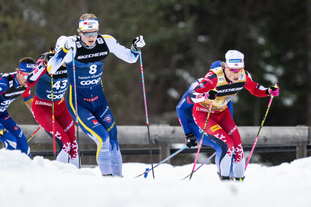 Edvin Anger of Sweden and Johannes Høsflot Klæbo of Norway compete in the Men's Cross Country Skiing 15 km Classic Mass start during day two of Tour de Ski on December 29, 2024 in Toblach.