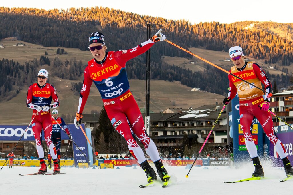 Lars Heggen, Johannes Høsflot Klæbo and Oskar Opstad Vike of Norway celebrate after the men's cross-country skiing free technique sprint final during the Tour de Ski on December 28, 2025 in Toblach.